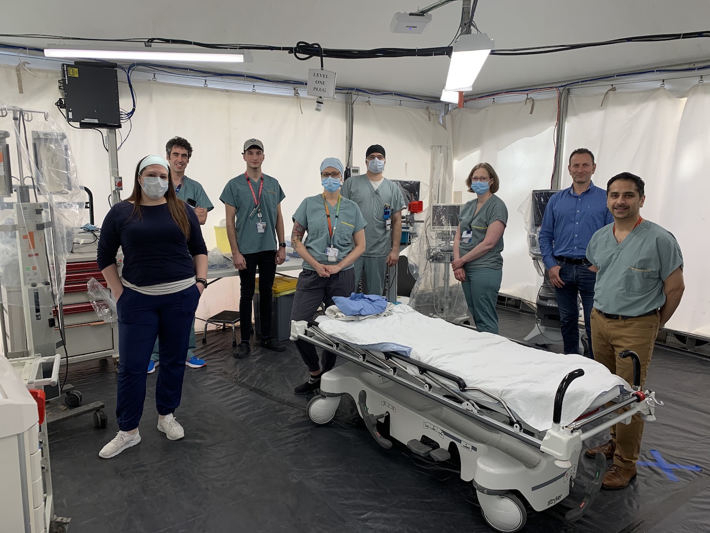 multidisciplinary teams pose inside the new resuscitation tent