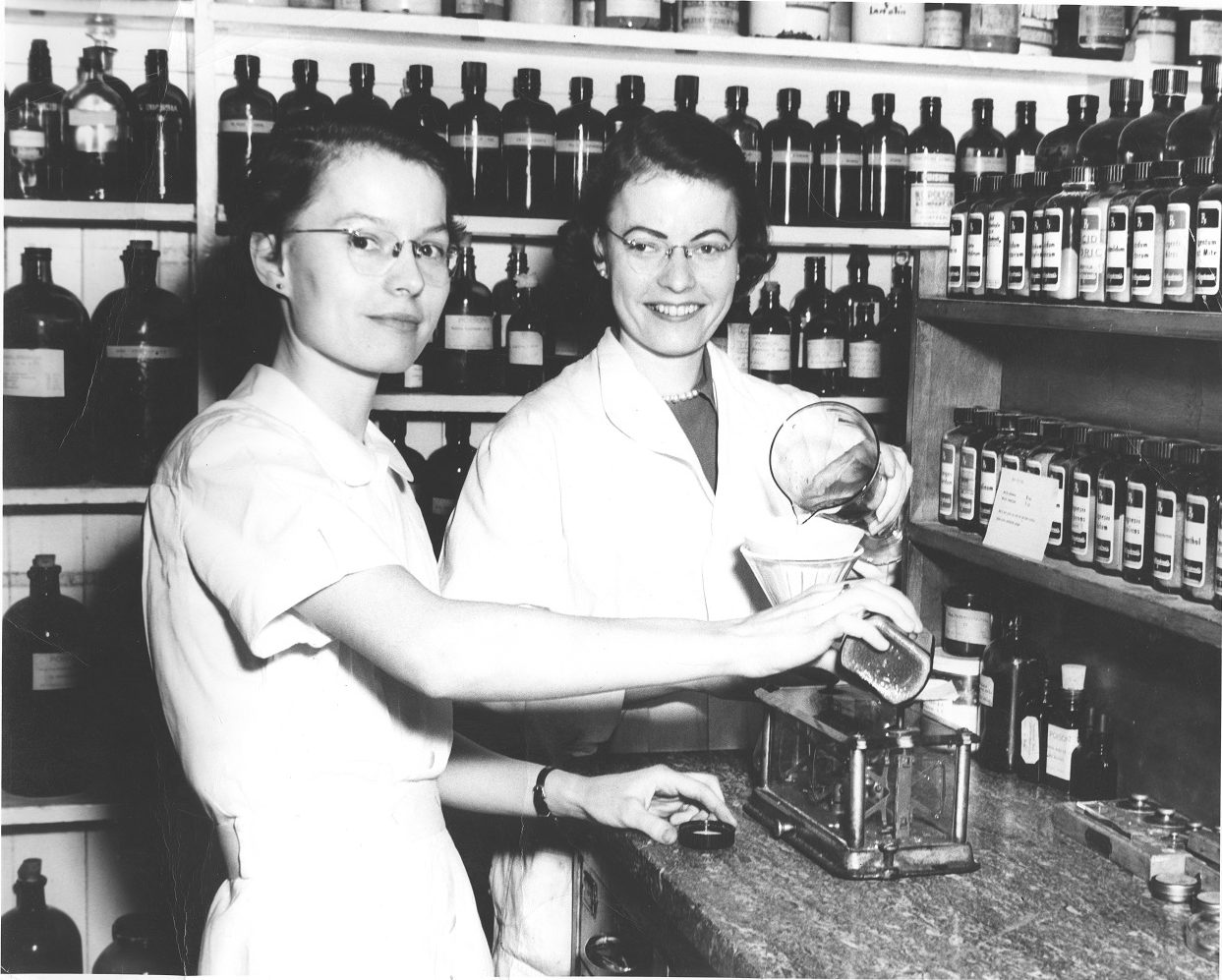 two sisters work in a 1950s era pharmacy